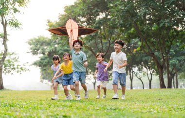 group image of cute asian children playing in the park