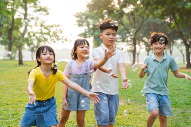 group image of cute asian children playing in the park
