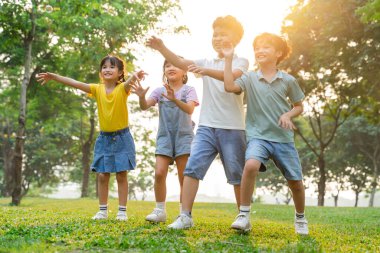 group image of cute asian children playing in the park
