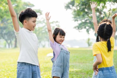 group image of asian children having fun in the park