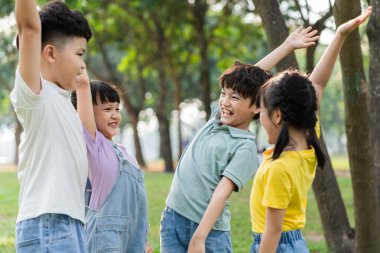 group image of asian children having fun in the park