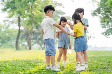 group image of asian children having fun in the park