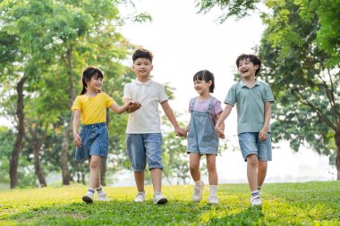 group image of asian children having fun in the park