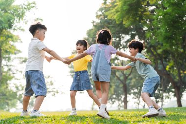 group image of asian children having fun in the park