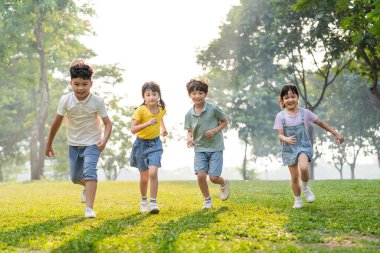 group image of asian children having fun in the park