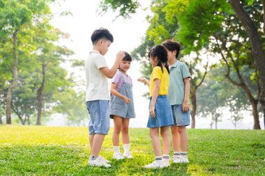 group image of asian children having fun in the park