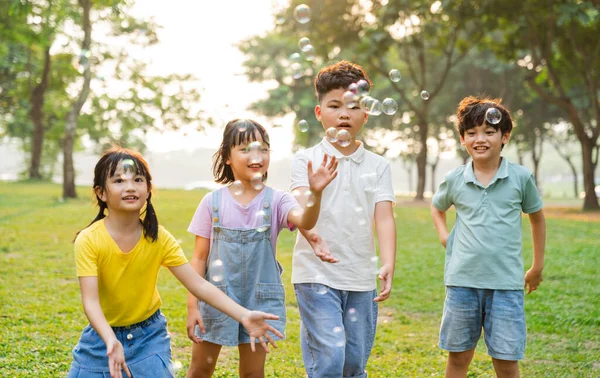 group image of cute asian children playing in the park