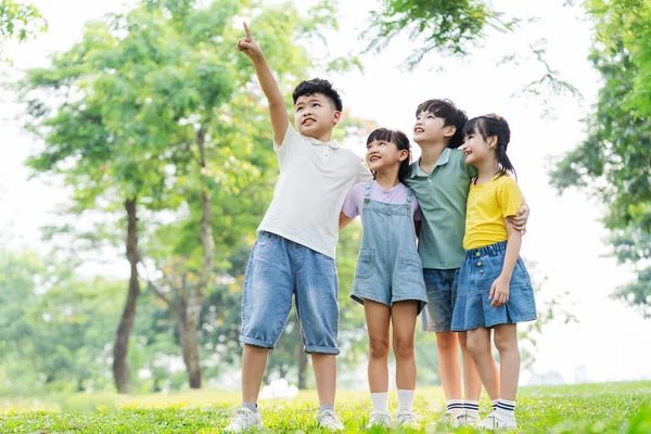 group of cute asian kids having fun in the park