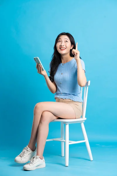 Portrait Beautiful Asian Woman Sitting Chair Blue Background — Stock Photo, Image