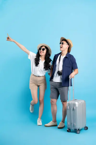 stock image Asian couple traveling image  isolated on blue background