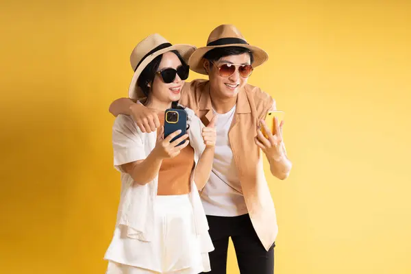 stock image Portrait image of couple posing on yellow background, summer, travel