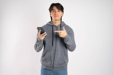 Portrait of asian man wearing hoodie posing on white background clipart