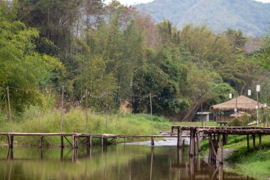 bamboo bridge and river at Utaradit, Thailand.