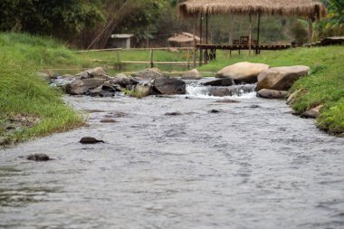 Stone and river at Utaradit, Thailand.