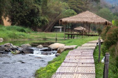 bamboo bridge and river at Utaradit, Thailand.