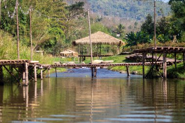 bamboo bridge and river at Utaradit, Thailand.