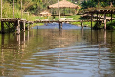 bamboo bridge and river at Utaradit, Thailand.
