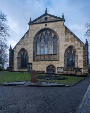 Scenic Greyfriars Kirkyard surrounding Greyfriars Kirk, one of the most visited tourist attractions of Edinburgh