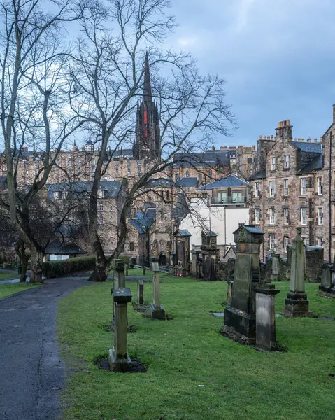 Scenic Greyfriars Kirkyard surrounding Greyfriars Kirk, one of the most visited tourist attractions of Edinburgh