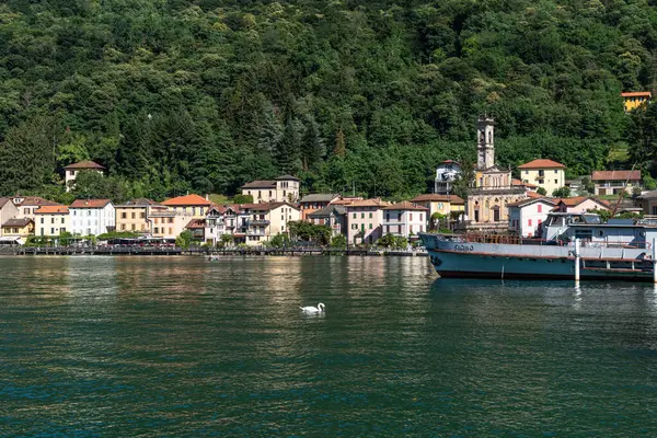 View of Porto Ceresio, a typical village located on the Italian side of Lugano Lake, Lombardy, Italy