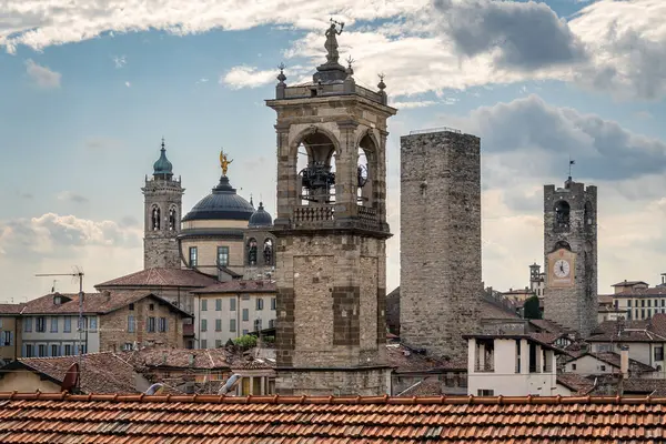 Cityscape and skyline of Bergamo old town viewed from the citadel with distinctive medieval towers and bell towers, Lombardy, Italy