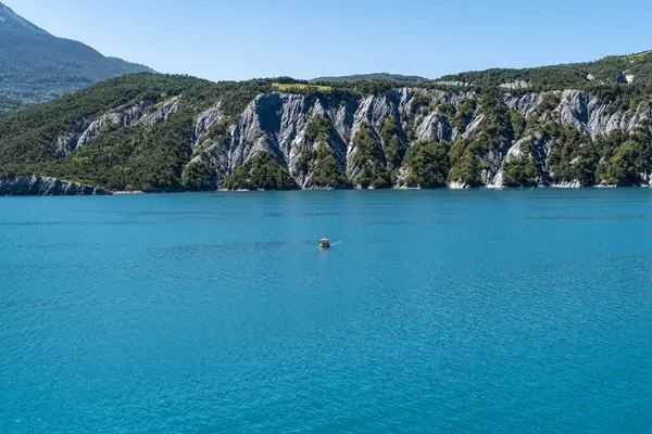 Beautiful summer landscape of the Lake of Serre-Poncon located and popular summer destination, Hautes-Alpes, France