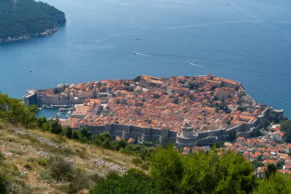 This aerial photograph captures the city of Dubrovnik and its bustling harbor, Croatia
