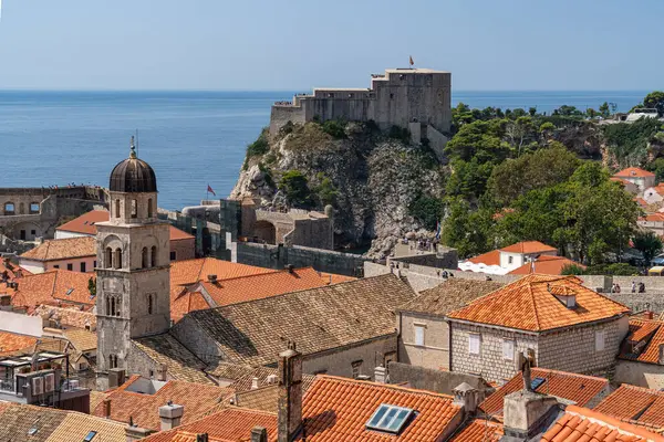 This photo captures a view of Dubrovnik city featuring Fort Lovrijenac in the background, showcasing the city historical charm, Croatia