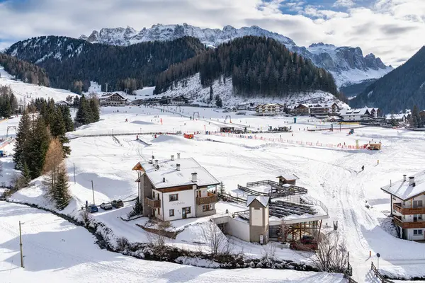 Snowy landscape at Selva di Val Gardena, nestled among towering Dolomites mountains, Alto Adige, Italy