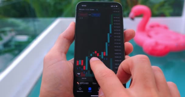 Successful Trader Holding Smartphone Alnalizes Stock Chart Cryptocurrencies Exchange Backdrop — Vídeos de Stock