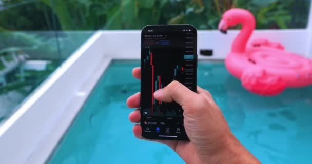 Male Trader Holding Mobile Phone Alnalizes Stock Chart Cryptocurrencies Stock — Video