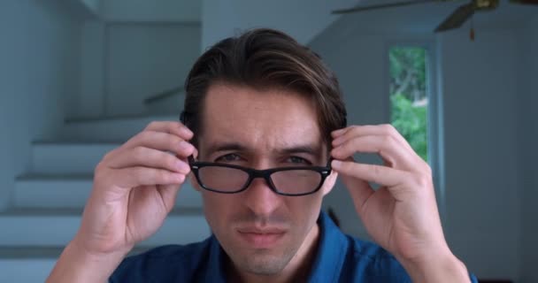 Man Millennial Poor Eyesight Puts Glasses See Better Indoors Close — Stockvideo