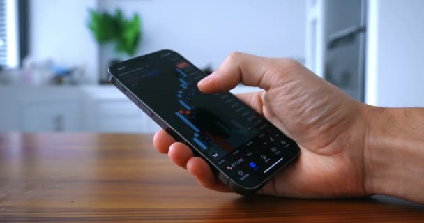 Investor Male Holding Mobile Phone Trading Crypto Stock Market Home — Video