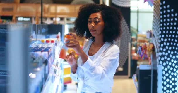 African American Woman Reads Content Label Checks Price Tag While — Stok Video