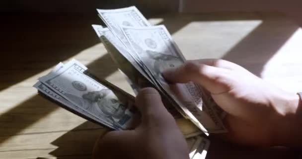 Counting Hundred Dollar Banknotes Wooden Table Ray Light Male Hands — Vídeos de Stock