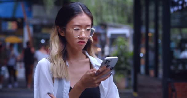 Portrait Sad Displeased Young Asian Woman Looking Mobile Phone Screen — Wideo stockowe