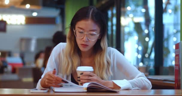 Young Asian Woman Her 20S Passionate Reading Interesting Book While — Vídeo de Stock