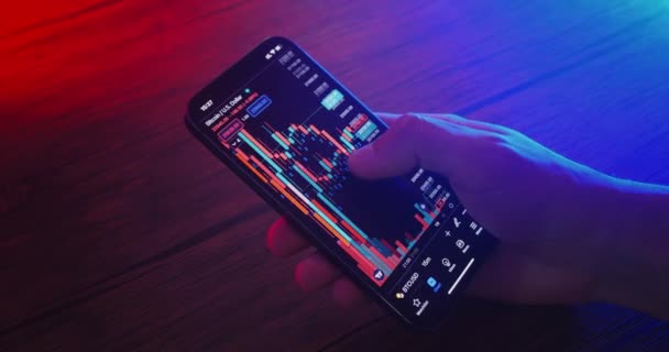 Close Successful Crypto Trader Holding Smartphone Analyzes Cryptocurrency Price Crypto — Vídeo de Stock