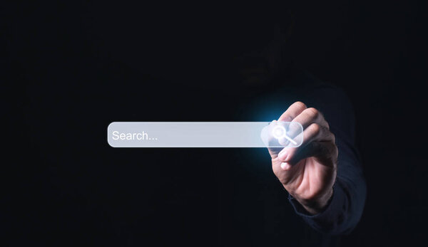 Internet search page being clicked on a computer's touch screen by a businessman while searching the internet is shown in the concept of information networking and data sharing. - Image