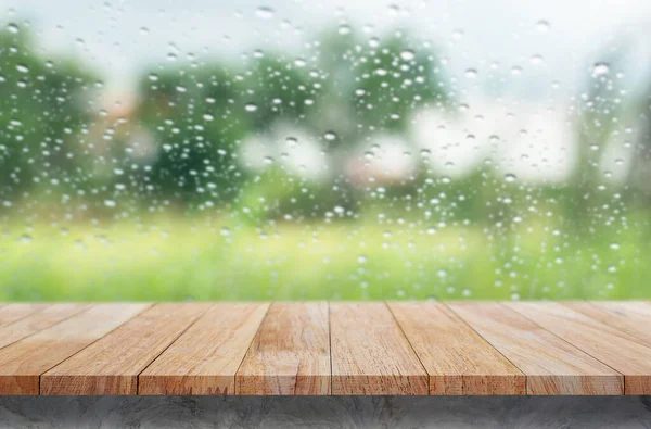 Use this wood tabletop with raindrops on a clear pane to showcase or montage your products.