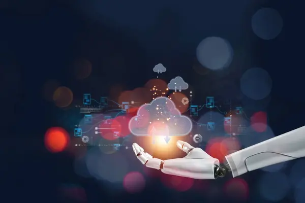 stock image A robotic hand holds a glowing cloud symbol, representing the integration of AI and cloud computing technology in data processing.