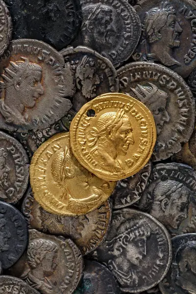 A treasure of Roman gold and silver coins.Trajan Decius. AD 249-251. AV Aureus.Ancient coin of the Roman Empire.Authentic silver denarius, antoninianus,aureus of ancient Rome.Antikvariat.