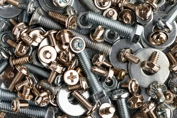 stock image Mixed screws and nails. Industrial background. Home improvement.bolts and nuts.Close-up of various screws. Use for background, top view.