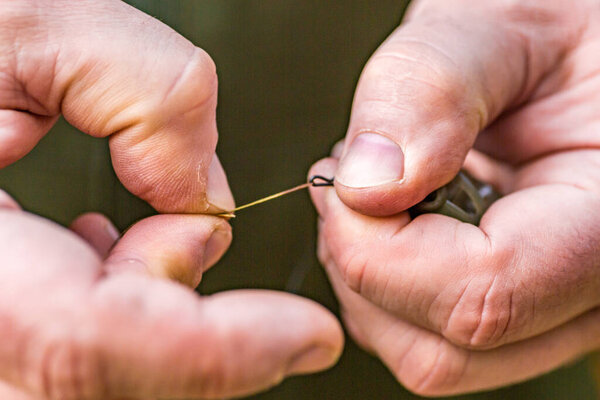 Carpfishing session at the Lake.Corn and oparod on the hook. Baiting fish on fishing.Dry feed for carp fishing as background for carp bait with fishing flat feeder for carp fishing.