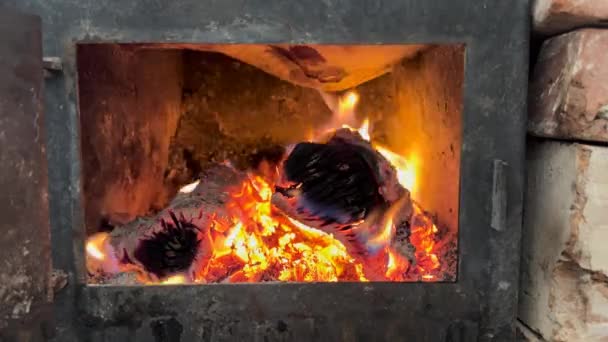 Iron Stove Open Door Coals Quietly Crackling Warmth Golden Light — Stock Video