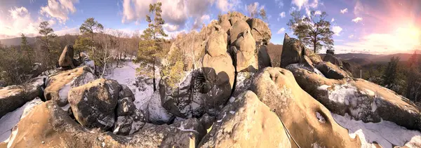 stock image Dovbush rocks in winter in Bubnyshche, Carpathians, Ukraine, Europe. Huge stone giants rise in the snowy transparent beech forest, all-round panoramic views are unique without leaves