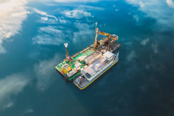 stock image Le Pouzin, France - 22 November 2022: Water barge with a river bed dredger located on the Rhone River in France