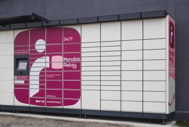 Loriol sur Drome, France - January 14, 2023: Lockers Mondial Relay. Pickup box a place by the road to send and receive parcels yourself. Mondial Relay is a French company providing postal services.