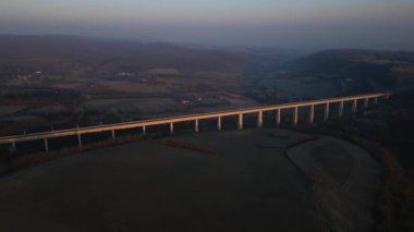 Panoramic drone view of the railway viaduct for high-speed trains. Overlooking the surrounding mountains in southern France