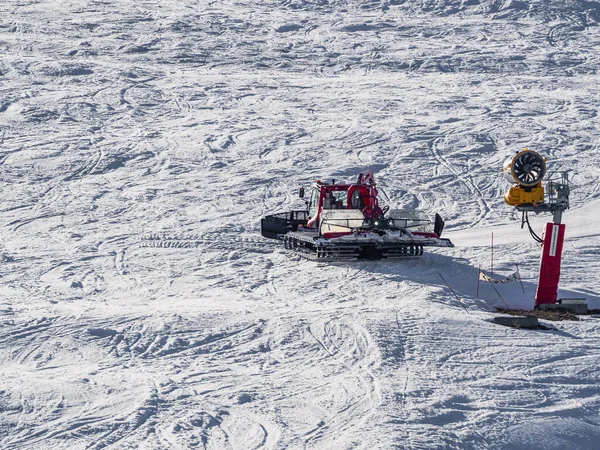 stock image Huez, France - 9 April 2023: Snowcat, ratrack PistenBully - machine for snow preparation while working in Alpe D'huez - One of the most popular ski resorts in the Alps in France